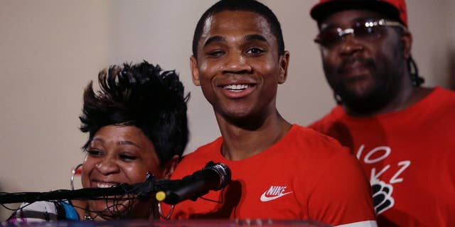 Davontae Sanford stands with his mother, Taminko Sanford and addresses the media during a news conference, Thursday, June 9, 2016 in Detroit. Sanford entered prison as a teenager in 2008 and was released Wednesday, a day after his guilty pleas to four fatal shootings were erased by a judge at the request of prosecutors who conceded the case was compromised by flawed police work. (AP Photo/Carlos Osorio)