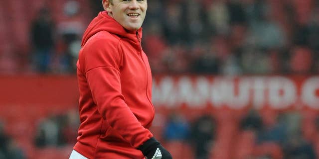 Manchester United's Wayne Rooney warms up ahead of during the English FA Cup Third Round match between Manchester United and Reading at Old Trafford in Manchester, England, Saturday, Jan. 7, 2017. (AP Photo/Rui Vieira)