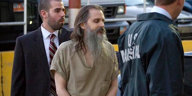 Nov. 4: Brian David Mitchell, the man accused of kidnapping Elizabeth Smart, is escorted into the Frank E. Moss Federal Courthouse in Salt Lake City. Nov. 8 Mitchell’s lawyer argued Mitchell was influenced by mental illness.