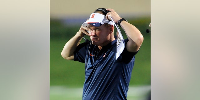 FILE - In this Sept. 7, 2013 file photo, Syracuse NCAA college football coach Scott Shaferwatches the action during an NCAA college football game against Northwestern University in Evanston, Ill. Shafer has had a bye week to right what went wrong against Georgia Tech. There was a lot to work on. (AP Photo/Matt Marton, File)