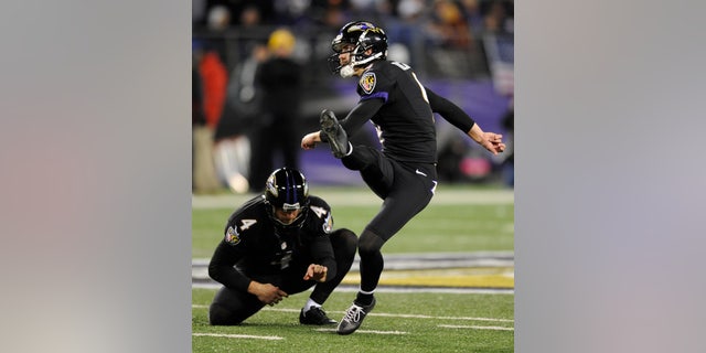 Baltimore Ravens' Justin Tucker (9) watches a successful field goal attempt alongside teammate Sam Koch in the second half of an NFL football game against the Pittsburgh Steelers, Thursday, Nov. 28, 2013, in Baltimore. Tucker contributed five field goals to Baltimore's 22-20 win. (AP Photo/Nick Wass)