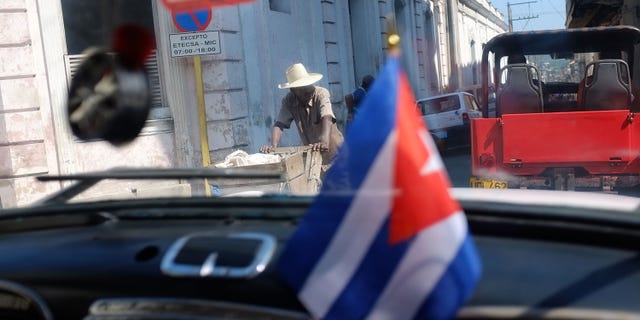 SANTIAGO DE CUBA, CUBA - MARCH 27: A street is seen through a car window a day after Pope Benedict XVI held a historic mass in the city on March 27, 2012 in Santiago de Cuba. Fourteen years after Pope John Paul II visited Cuba, Pope Benedict is making his first trip to the communist country. Benedict, who arrived from Mexico, conducted a mass in the city of Santiago de Cuba first followed by a mass in Havana before leaving on the 28th. Tensions are high in Cuba between dissidents and the government as activists hope the international exposure of the Papal visit will result in renewed attention to their struggle for greater freedoms. (Photo by Spencer Platt/Getty Images)