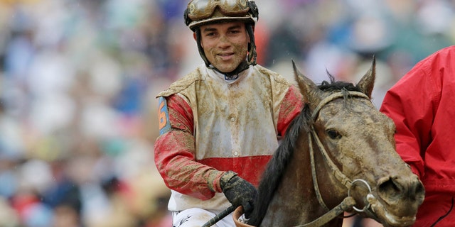 Joel Rosario reacts after riding Orb to victory in the Kentucky Derby at Churchill Downs Saturday, May 4, 2013, in Louisville, Ky.