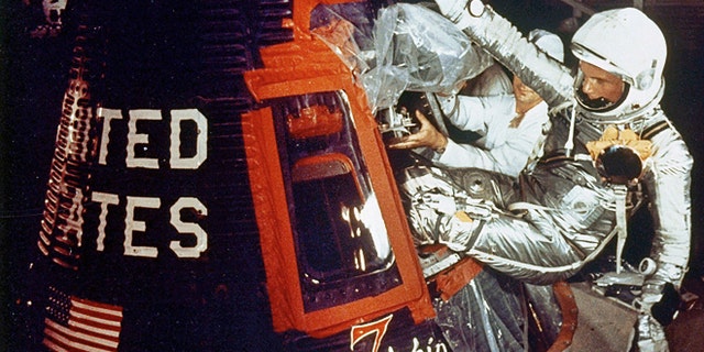 Feb. 20, 1962: Astronaut John Glenn climbs into the Friendship 7 space capsule atop an Atlas rocket at Cape Canaveral, Fla. for the flight which made him the first American to orbit the earth.