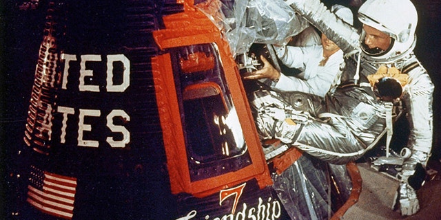 Feb. 20, 1962: Astronaut John Glenn climbs into the Friendship 7 space capsule atop an Atlas rocket at Cape Canaveral, Fla. for the flight which made him the first American to orbit the earth.