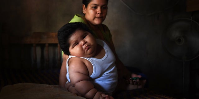 His mother said he was born weighing around 8 pounds, but that they noticed his rapid weight gain when he was about one month old.