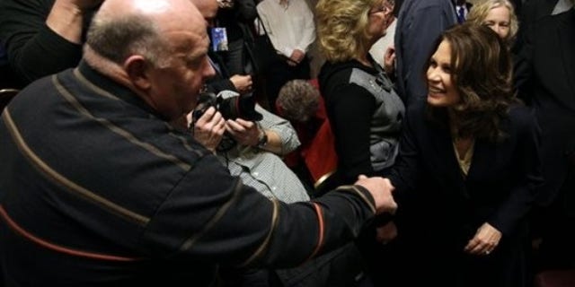 In this Jan. 21, 2011 file photo, U.S. Rep. Michele Bachmann, R-Minn. , greets Jim Ervin, of Urbandale, Iowa, left, after speaking at a reception by the Iowans for Tax Relief in Des Moines, Iowa. (AP)
