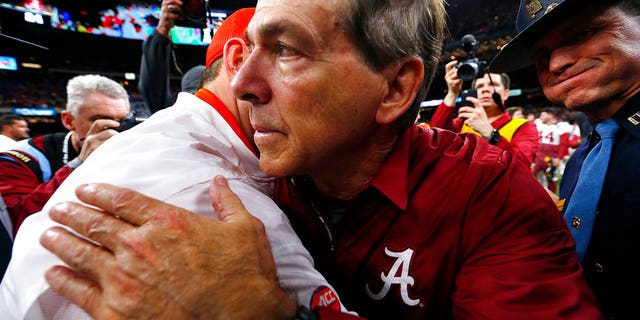 Alabama head coach Nick Saban, right, hugs Clemson head coach Dabo Swinney after the Sugar Bowl game, in New Orleans, Jan. 1, 2018.