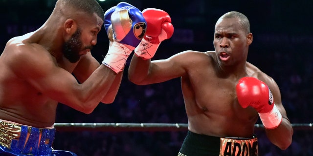 Adonis Stevenson, right, and Badou Jack exchange blows during the first round of the WBC light heavyweight championship boxing match in Toronto on Saturday
