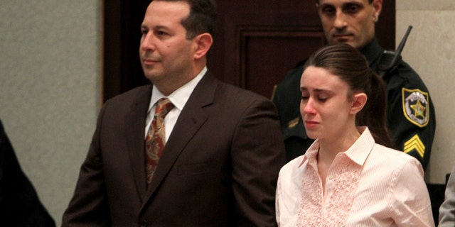 Casey Anthony holds hands with her defense attorney Jose Baez as they listen to the verdict at the Orange County Courthouse, July 5, 2011.