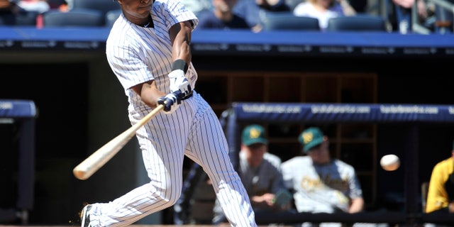 New York Yankees' Chris Nelson bas against the Oakland Athletics during the fourth inning of a baseball game at Yankee Stadium on Saturday, May 4, 2013 in New York. Nelson was acquired from the Colorado Rockies. He struck out in the at-bat. (AP Photo/Kathy Kmonicek)