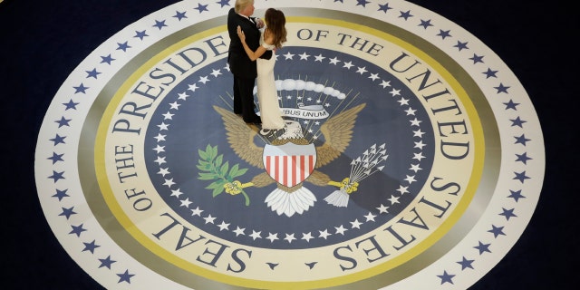 In this Jan. 20, 2017, file photo, President Donald Trump dances with first lady Melania Trump, at The Salute To Our Armed Services Inaugural Ball in Washington.