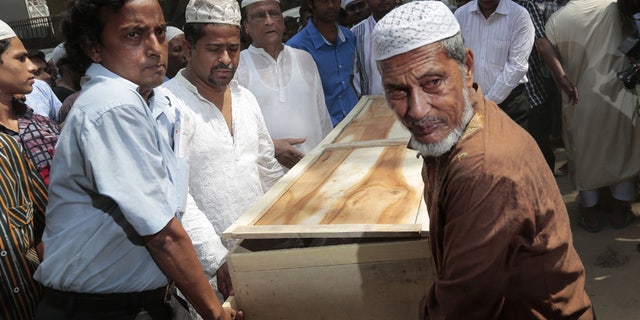 April 26, 2016: Bangladeshi Muslims carry the body of Xulhaz Mannan who was stabbed to death by unidentified assailants for his funeral in Dhaka, Bangladesh.