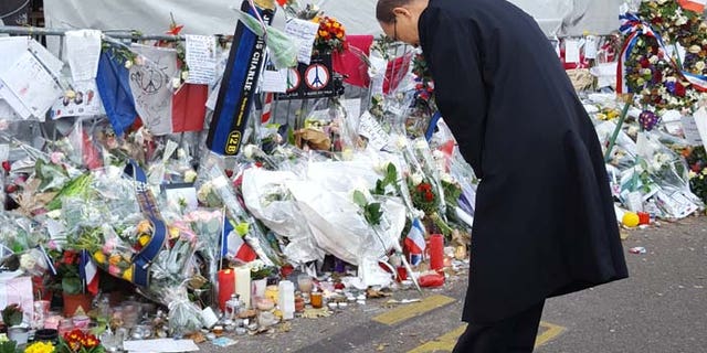 UN General Secretary Ban Ki-moon pays respects at the memorial outside The Bataclan, the music venue where terrorists gunned down scores of patrons on Nov. 13. (Casey Sherman)