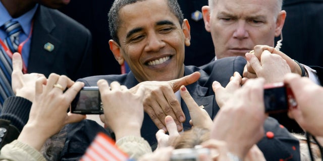 April 5, 2009. U.S. President Barack Obama shakes hands with well-wishers at Hradcanske Square in central Prague.