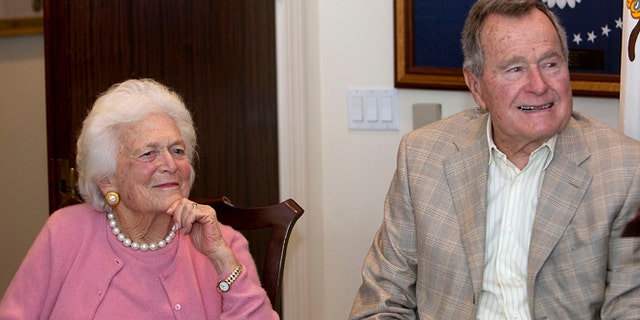 Dec. 23, 2013: Former first lady Barbara Bush, left, and former President George H. W. Bush look on during a ceremony at President Bush's office in Houston.