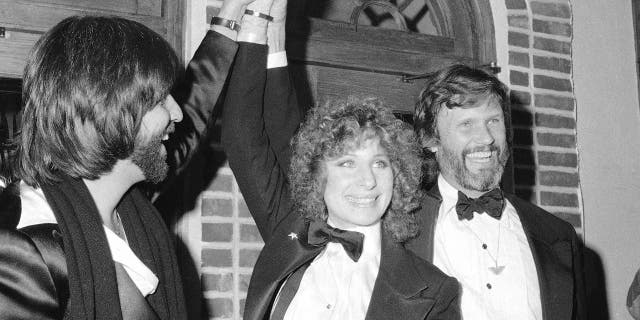 Here, producer Jon Peters, from left, Barbra Streisand and Kris Kristofferson appear at a preview of the film, "A Star is Born," in New York.
