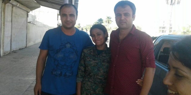 Barin Kobani with her brothers