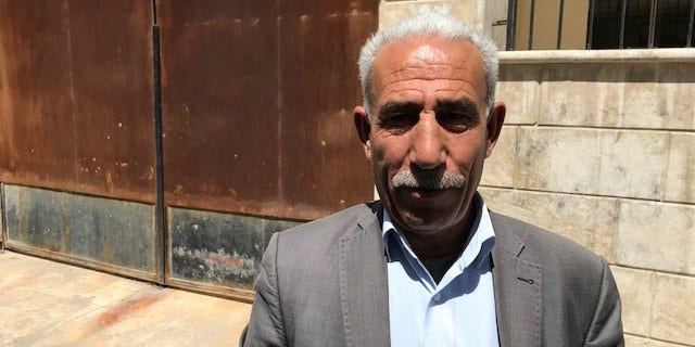 Khalil, a member of the Martyrs Foundation who delivers news to families if their relatives have been killed in action.