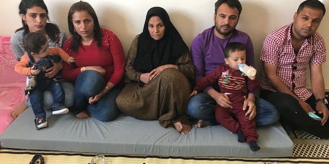 Barin Kobani's family: sisters, mother and brothers mourning her death in Kobani, Syria.