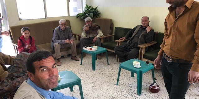 Those who have lost loved ones in the protracted Syrian conflict gather at the Martyrs Family Foundation.