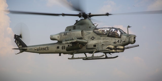 File photo - A U.S. Marine AH-1Z Viper with Marine Light Attack Helicopter Squadron 369 flies alongside a UH-1Y Venom at Ban Chan Khrem, Thailand, Feb. 21, 2018.