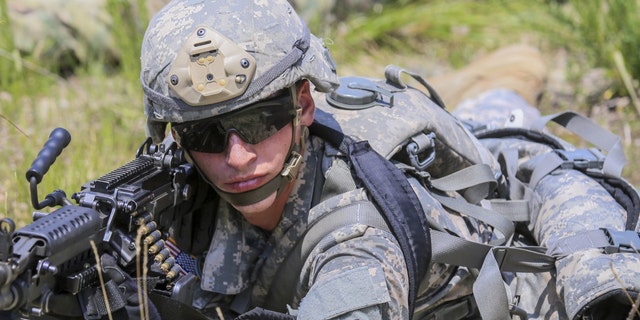File photo - a U.S. soldier with an M249 SAW (U.S. Army)