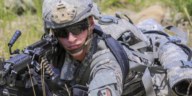 File photo - a U.S. soldier with an M249 SAW (U.S. Army)
