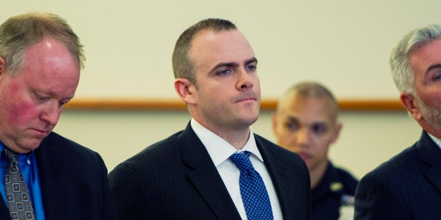 In this May 31, 2017 file photo, New York City Police Sgt. Hugh Barry, center, is arraigned at Bronx Supreme Court in the death of Deborah Danner.