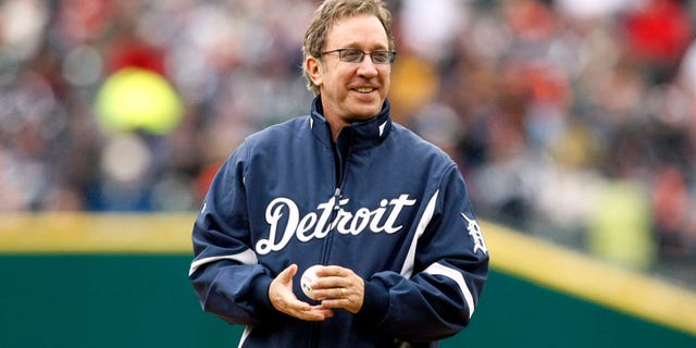 Television comedian Tim Allen stands on the pitchers mound with the ceremonial pitch ball before the start of the Detroit Tigers' MLB American League baseball season home opener against the Cleveland Indians in Detroit, Michigan April 9, 2010. REUTERS/Rebecca Cook (UNITED STATES - Tags: SPORT BASEBALL) - RTR2CMKU