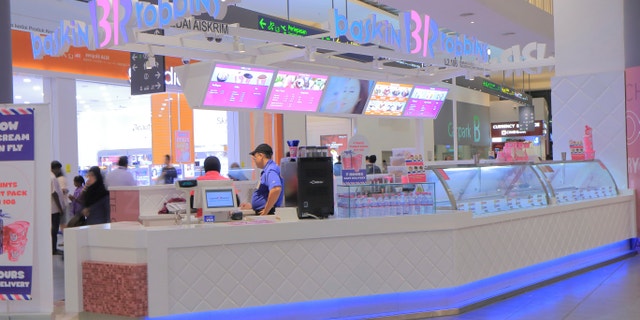 Kuala Lumpur Malaysia - September 13, 2014: People work at Baskin Robbins Ice cream shop at KLIA2 Airport in Kulala Lumpur Malaysia.