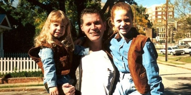 John Battaglia pictured with his two daughters.