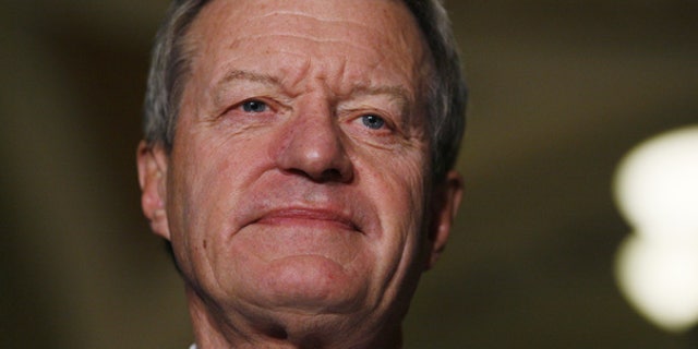 Oct. 15: Senate Finance Committee Chairman Sen. Max Baucus, D-Mont., looks on before speaking to reporters about health care reform legislation. (AP)