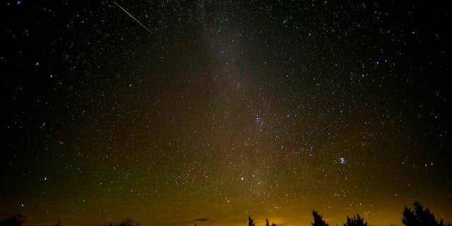 This 30-second exposure shows a meteor streaking across the sky during the annual Perseid meteor shower Friday, Aug. 12, 2016 in Spruce Knob, West Virginia.
