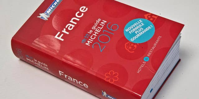 FILE - In this Feb.1, 2016 file photo, the Michelin Guide 2016 is pictured in Paris. The leader of an umbrella organization representing world Jewry has asked the Michelin travel guide company to evaluate Israeli restaurants with its famous rating system, implying that the decision to omit the country may be political. (AP Photo/Michel Euler, File)