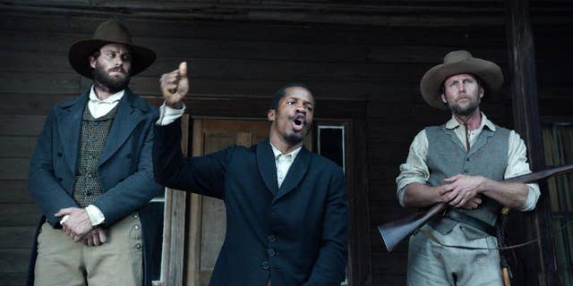In this image released by Fox Searchlight Pictures, from left, Armie Hammer portrays Samuel Turner, Nate Parker portrays Nat Turner and Jayson Warner Smith portrays Earl Fowler in a scene from "The Birth of a Nation," opening Oct. 7, 2016. Parker said he hopes the movie will inspire people to challenge injustices worldwide and said the lecture series would help. (Fox Searchlight Pictures via AP)