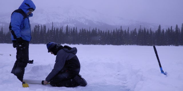 Scientists prepare to take the core samples.