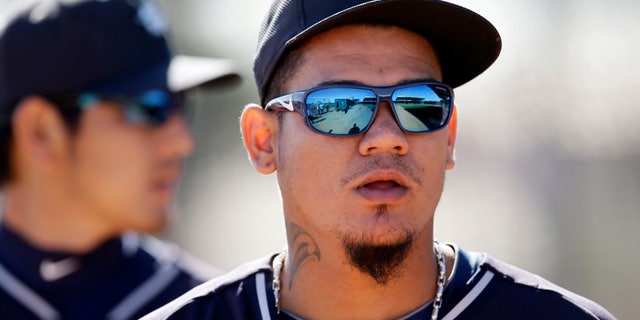 Seattle Mariners' Felix Hernandez walks out of the bullpen after a throwing session during spring training baseball practice, Thursday Feb. 20, 2014, in Peoria, Ariz. (AP Photo/Tony Gutierrez)