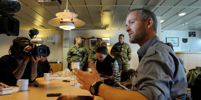 Danish chemical expert Bjorn Schmidt speaks to reporters aboard the Danish frigate HDMS Esbern Snare in Cyprus’ Limassol port on Saturday, Dec. 14, 2013. Schmidt said that Danish and Norwegian cargo vessels can safely ferry up to 500 tons of Syria’s most dangerous chemical weapons out of the strife-torn country. He said sealed containers full of chemical compounds that when mixed can create lethal Sarin and VX gasses will be loaded at opposite ends of the two cargo ships.(AP Photo/Pavlos Vrionides)