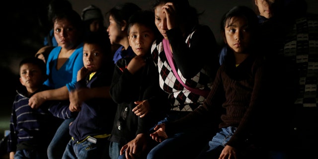 Group of immigrants from Honduras and El Salvador are stopped in Granjeno, Texas, on June 25, 2014.