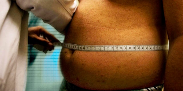 ** ADVANCE FOR SUNDAY, SEPT. 28 ** Angel Moreno, 14, who weighs 71.5 kg, or 156.528 lb, gets a check-up at Mexico's Children's Hospital in Mexico City, Friday, Aug. 29, 2008. Mexico is on track to surpass the United States as one of the world's fattest countries by 2018. Nearly half of Mexico's 110 million people already are overweight, while the number of fat children has climbed 8 percent a year in the last decade. (AP Photo/Alexandre Meneghini)