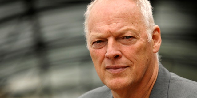 FILE - An Aug. 13, 2008, file photo is of former Pink Floyd band member David Gilmour in London. Police say a 53-year-old man who went to a Minnesota hospital for treatment on April 20, 2013, is accused of pretending to be singer-guitarist David Gilmour _ and racking up as much as $100,000 in unpaid medical bills. Authorities say the man didn't have health insurance, was treated and released, but not before signing an autograph. (AP Photo/Joel Ryan, File)