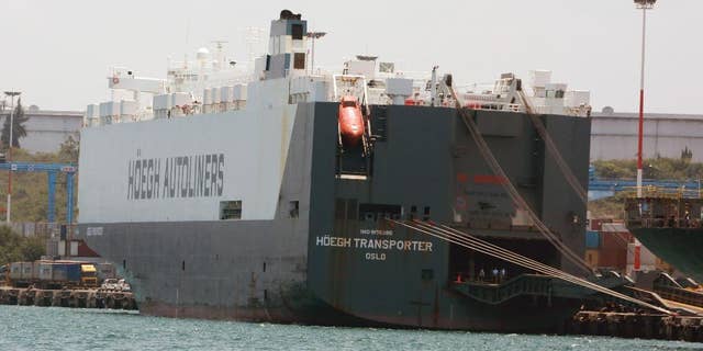 In this photo taken on Friday, Sept. 25, 2015, the Norwegian flagged Hoegh Autoliners cargo ship is photographed at the port of Mombasa, in Kenya. The Norwegian owner of a ship intercepted in Kenya says the vessel has been set free and allowed to its voyage to South Africa, West Africa and Mexico.  Hoegh Autoliners said in a statement seen Sunday that, after a delay of more than a week, no crew have been arrested. No illegal drugs were found, it added.  (AP Photo)