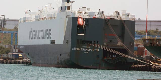 In this photo taken on Friday, Sept. 25, 2015, the Norwegian flagged Hoegh Autoliners cargo ship is photographed at the port of Mombasa, in Kenya. The Norwegian owner of a ship intercepted in Kenya says the vessel has been set free and allowed to its voyage to South Africa, West Africa and Mexico. Hoegh Autoliners said in a statement seen Sunday that, after a delay of more than a week, no crew have been arrested. No illegal drugs were found, it added. (AP Photo)