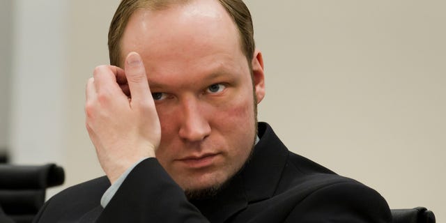 Confessed mass killer Anders Behring Breivik sits in the courtroom in Oslo, Norway Friday 1 June, 2012. Norwegian police said they are confident that confessed mass killer Anders Behring Breivik acted on his own in terror attacks last year that killed 77 people and that they found no evidence he belonged to a Europe-wide anti-Muslim network. (AP Photo/Heiko Junge,Pool)