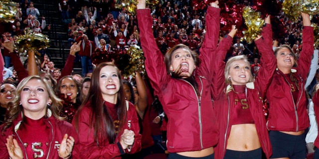 Jan. 6, 2014: Florida State Golden Girls cheerleaders react as they watch Florida State score a touchdown on a 30-foot screen at the Tallahassee Leon County Civic Center in Tallahassee, Fla. in the second quarter of the NCAA BCS National Championship college football game against Auburn.