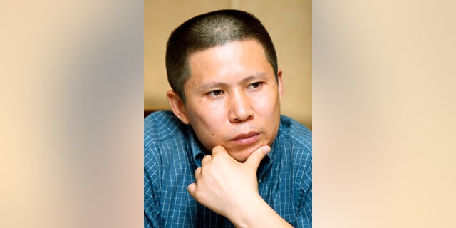 FILE - In this July 17, 2009 file photo, legal scholar Xu Zhiyong, is seen at a meeting in Beijing, China. Xu, one of China's most well-known civil rights advocates, has been formally arrested on charges of disrupting public order, as Beijing cracks down on grassroots efforts to build a civil society that may challenge its rule. Xu, a founder of the loosely organized New Citizens group, has called for people to hold monthly dinners to discuss China's constitution and other issues. Several citizen activists who want to hold public officials to account and champion the underprivileged stand trial this week in Beijing in cases reflecting an intense campaign under leader Xi Jinping to quash any potential threat to China’s one-party rule. (AP Photo/Greg Baker, File)