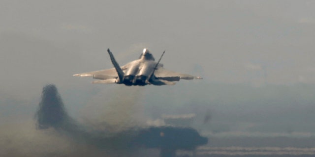A F-22 stealth fighter jet belonging to the U.S. Air Force takes off at a U.S. air force base.