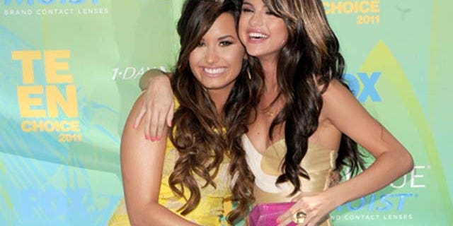 August 07, 2011: Actresses/singers Demi Lovato and Selena Gomez arrive at the 2011 Teen Choice Awards held at the Gibson Amphitheatre in Universal City, Calif.