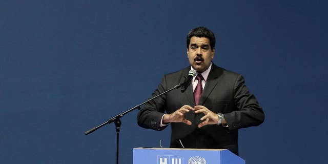 Venezuela's President Nicolas Maduro speaks during the opening of the third United Nations Habitat Conference, in Quito, Ecuador, Monday, Oct. 17, 2016. The meeting kicked off in Quito on Monday with the goal of tackling haphazard growth and fostering livable, self-sustaining cities amid a boom in the global urban population. (AP Photo/Dolores Ochoa)